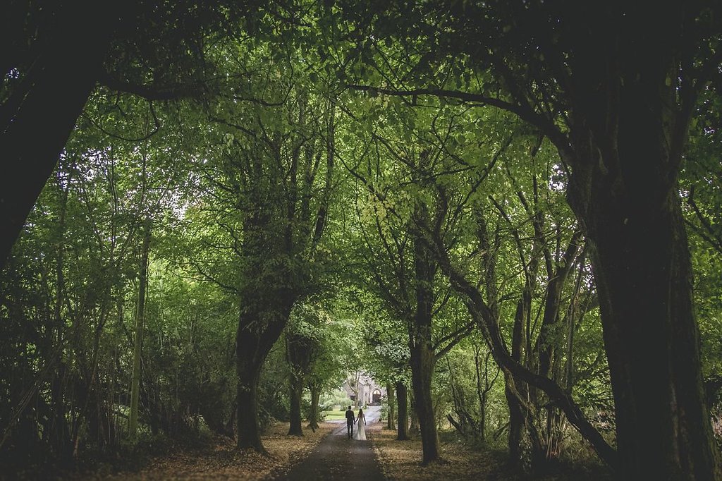 bride and groom walking to their wedding venue